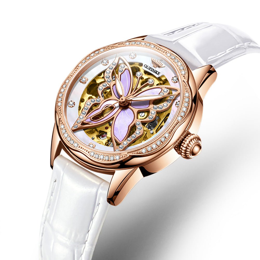 Luxury watch with butterfly design and rose gold casing on white background
