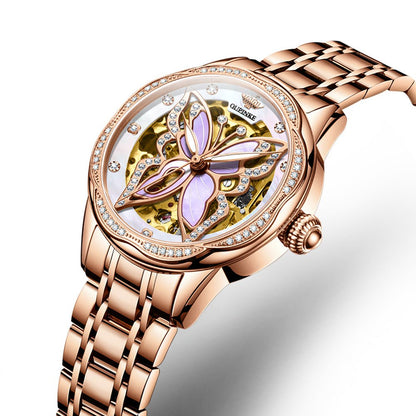 Luxury watch with butterfly design and rose gold strap on white background