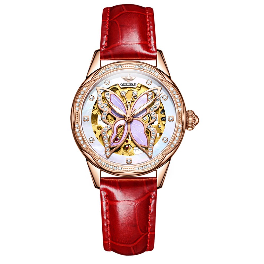 Luxury watch with red leather strap and butterfly design on white background