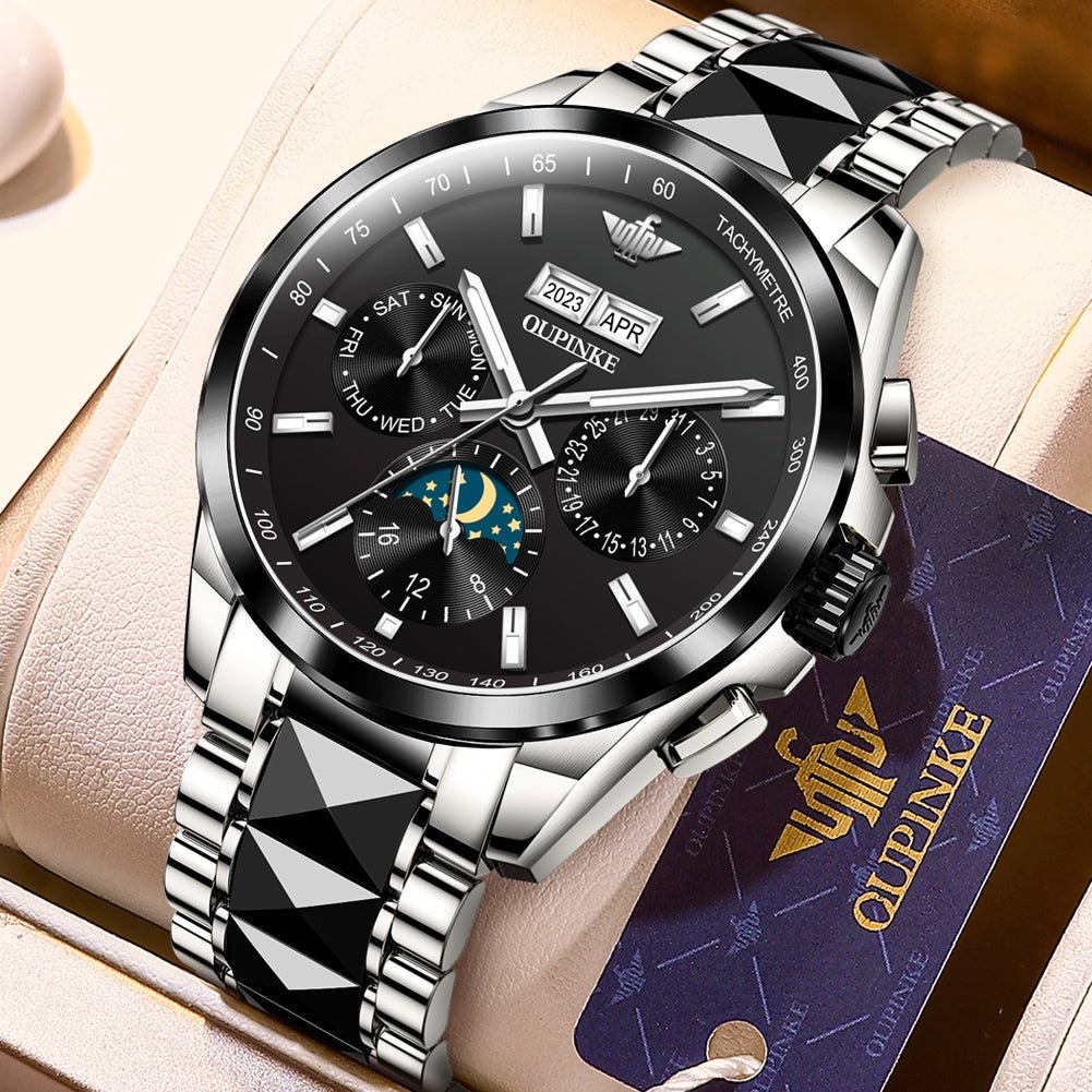Luxury watch with silver and black design on a beige cushion, featuring the brand 'QUPINKE'.