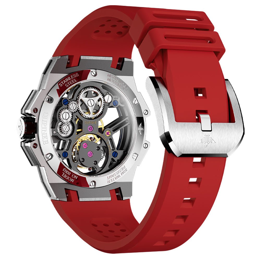 Watch with red strap and visible mechanical components on a white background